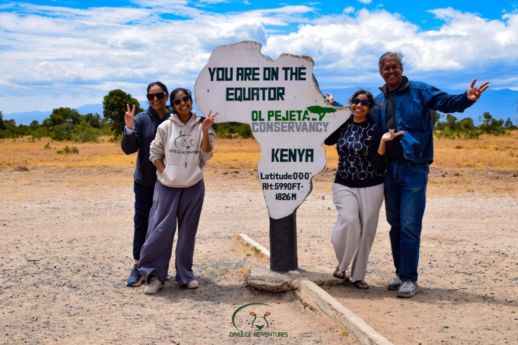 Divulge Adventures clients at the equator sign in Ol Pejeta Conservancy