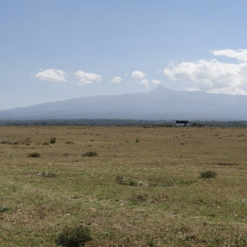 Mount Kenya rising beyond open plains near Lamuria