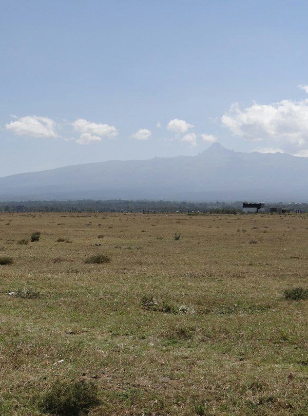 Mount Kenya rising beyond open plains near Lamuria