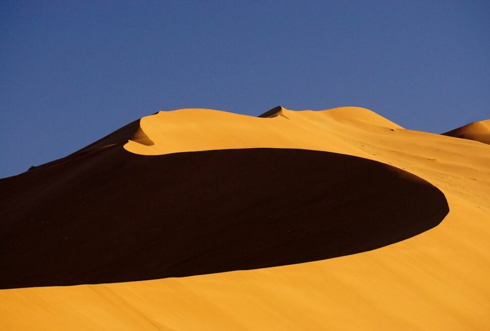 Best time to visit Namibia – early morning shadows across the Namib Sand Sea dunes