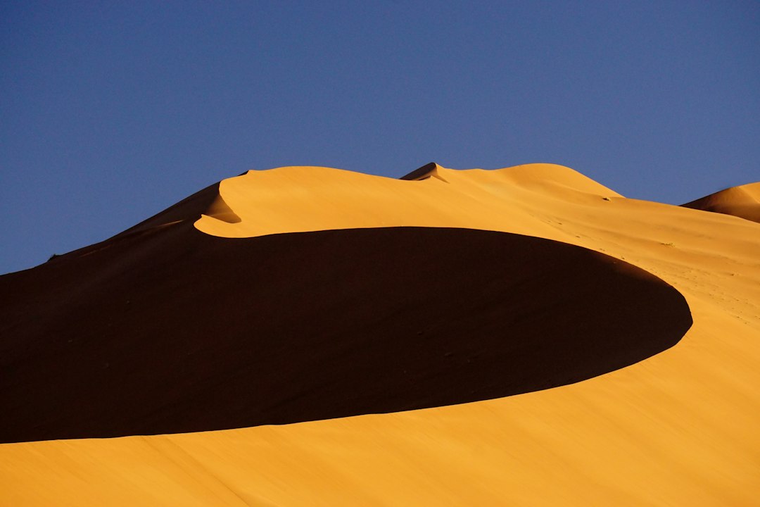 Best time to visit Namibia – early morning shadows across the Namib Sand Sea dunes